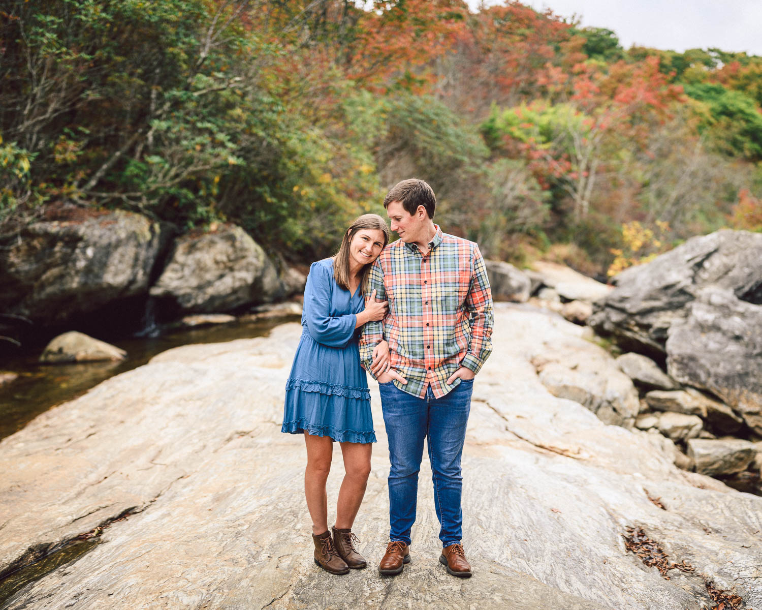 Couple pose for photo in fall
